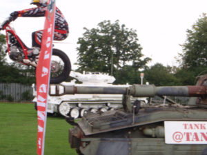 Dougie Lampkin Rides his bike over our tanks