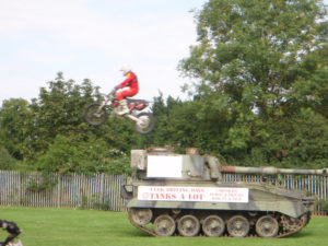Dougie Lampkin Rides his bike over our tanks