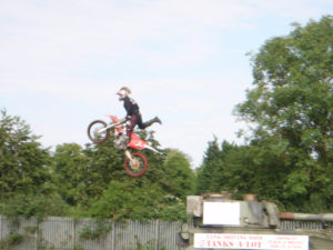 Dougie Lampkin Rides his bike over our tanks