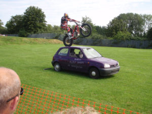 Dougie Lampkin Rides his bike over our tanks